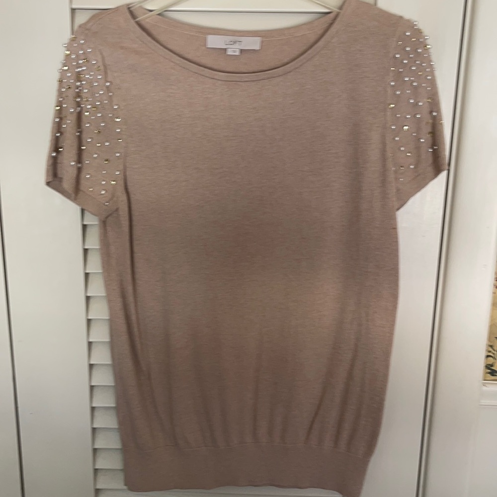 Short beaded sleeve sweater.